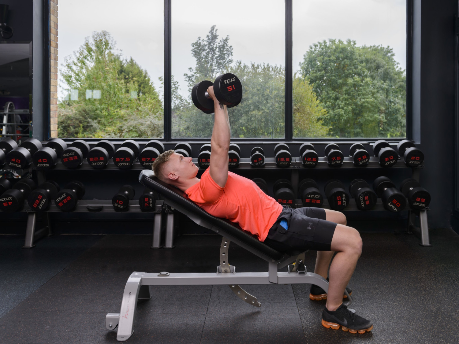Man performing chest presses in Westmanstown gym