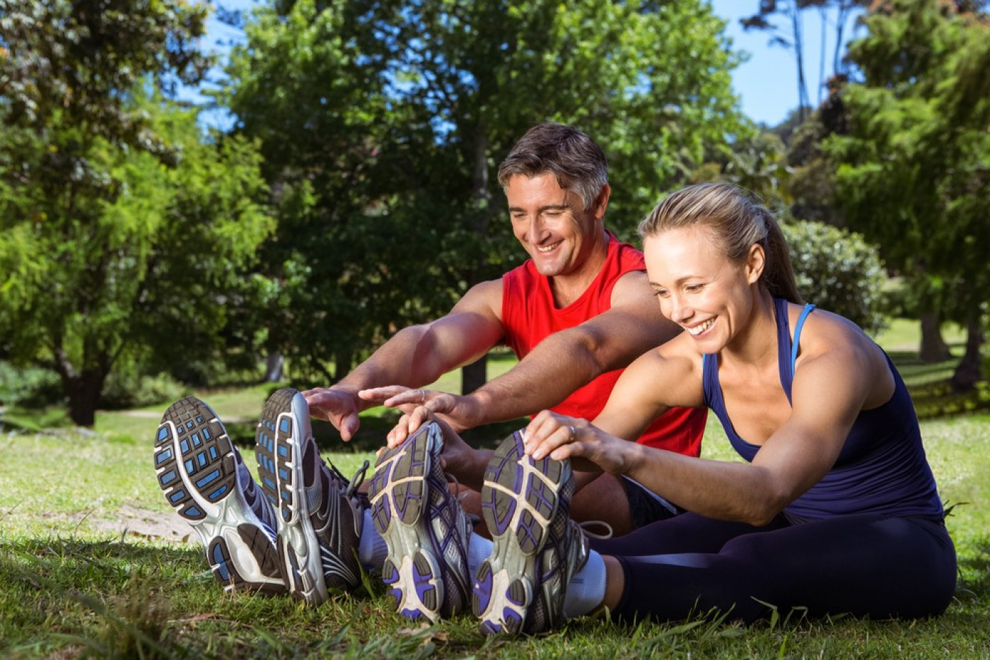 Why exercise? Couple exercising in the park